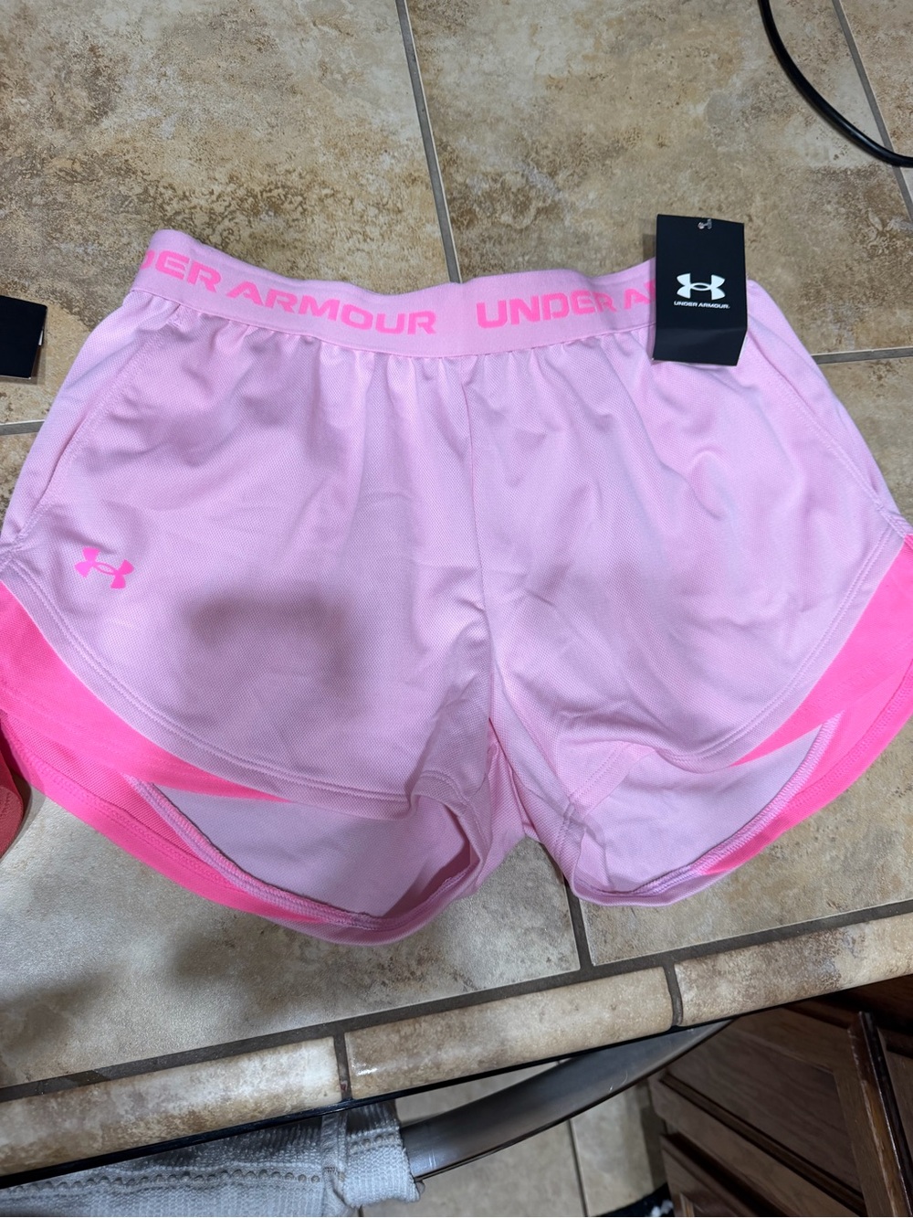 Under Armour Women’s Light Pink Athletic Shorts with Bright Pink Trim